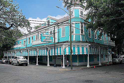 The Exterior of Commanders Palace - Blue and White Victorian Building occupying much of the block