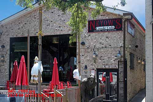 Exterior of Neyow's Creole Cafe with Umbrellas and Patio